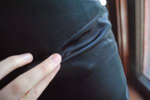 Extra fabric below yoke seam