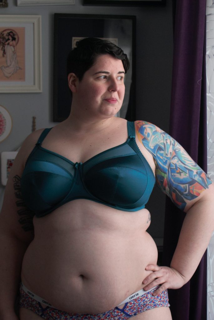 Emerald green Goddess Keira bra, front profile. Plus size, full coverage bra with sheer upper cup, small bow detail on gore