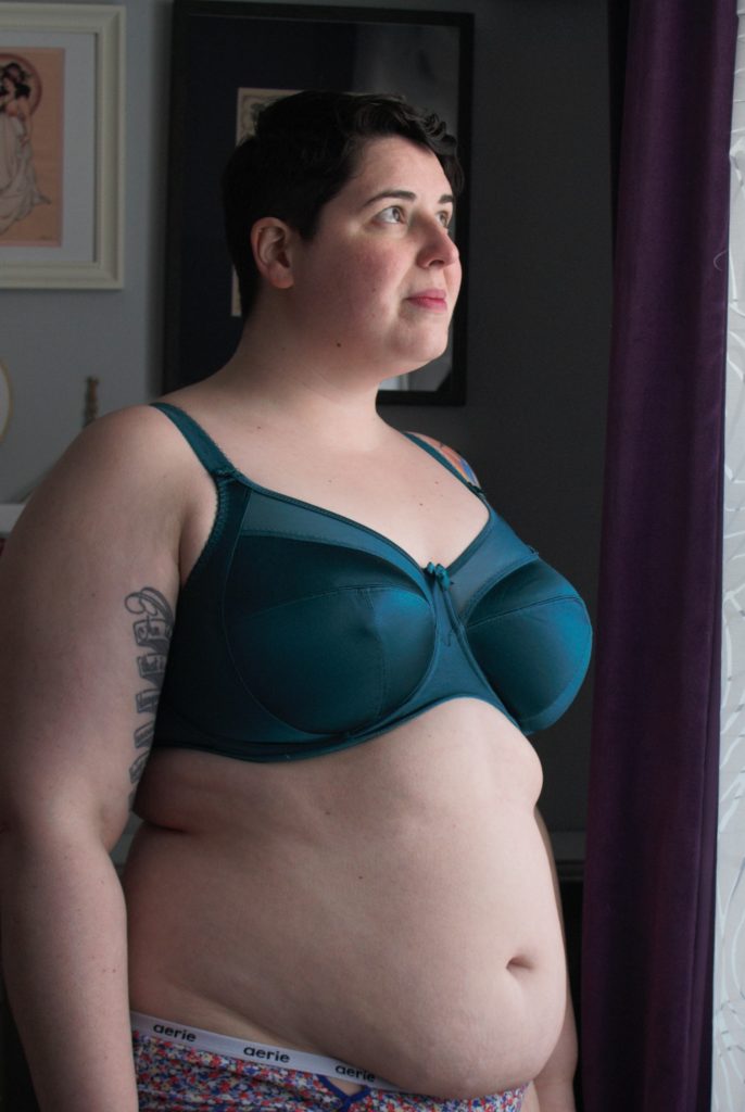 Emerald green Goddess Keira bra, side profile. Plus size, full coverage bra with sheer upper cup.