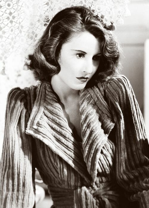 Barbara Stanwyck in a chenille robe for Remember the Night (1940)