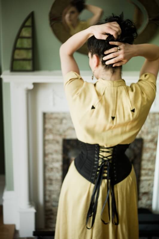 Dark Garden owner Autumn Adamme shows off the lacing on her corset. Photo © Joel Aron