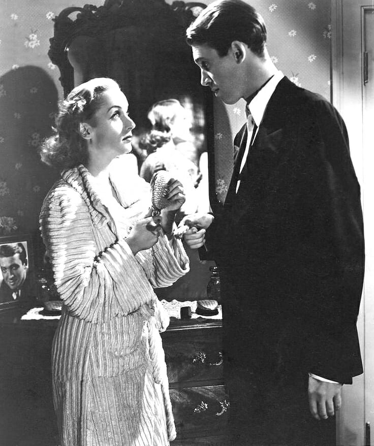 Carole Lombard, wearing a chenille robe, and Jimmy Stewart in Made for Each Other, 1939