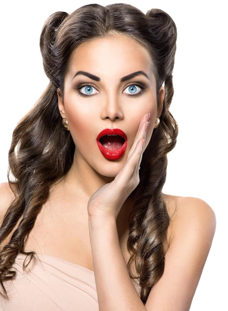 Surprised retro woman. Beauty vintage excited girl over white