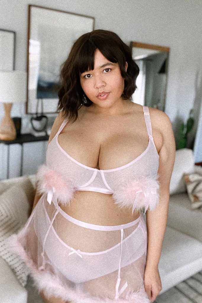 Gabi Fresh wears a pink tulle and marabou feather bra, panty, and suspender skirt from Playful Promises, perfect Valentine's Day Lingerie
