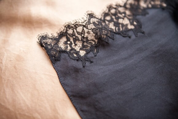 Lace appliqué and tiny rolled hem