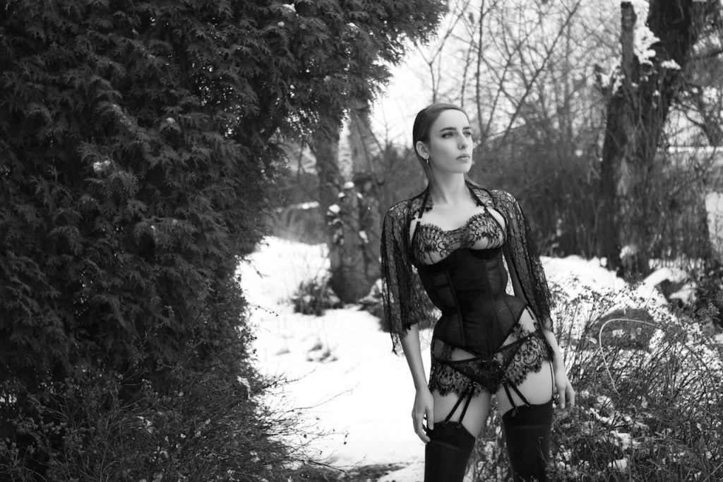 Karolina Laskowska 2017 'Taakeferd' Lingerie Collection. Mesh corset with lace bra and knickers and lace capelet. Taken in snowy Norway.