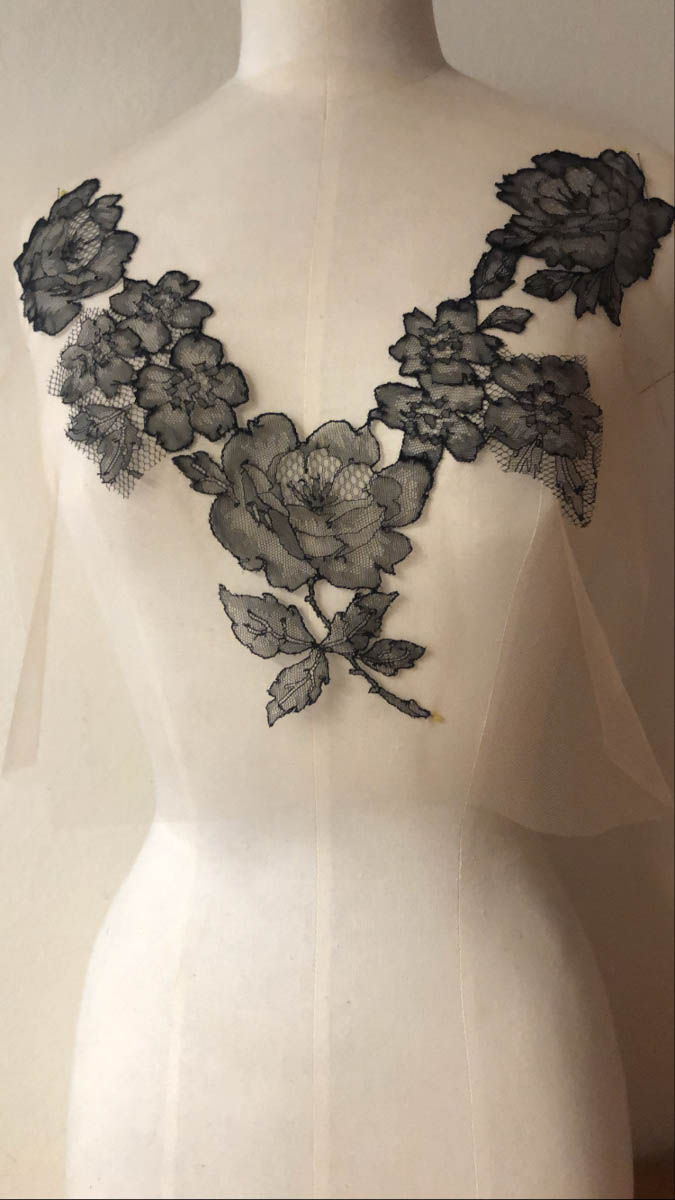 Lace motifs being draped on a mannequin to determine appliqué placement. Photo courtesy of Merle Noir Lingerie