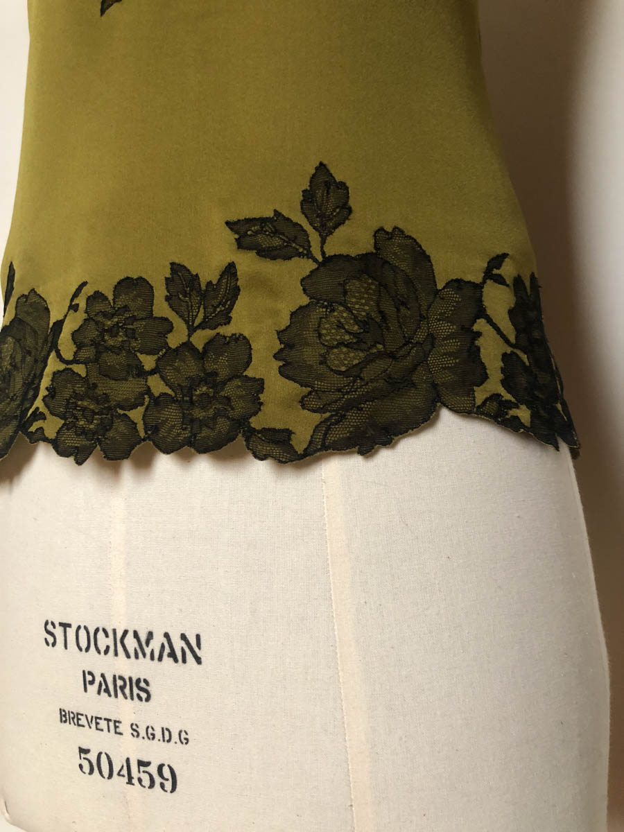 Detail of a lace appliquéd hem on a Merle Noir camisole. Image courtesy of Merle Noir