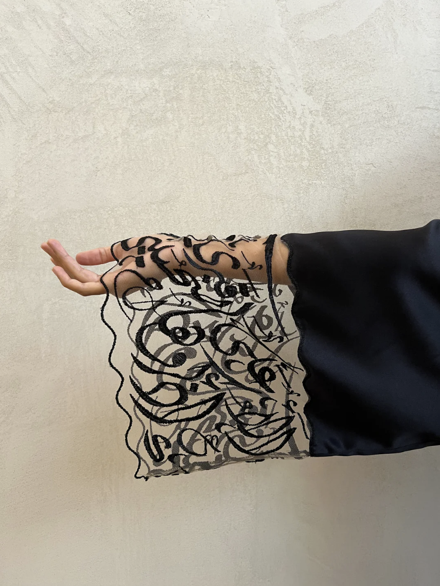 Hadal Lingerie love robe sleeves detail of arabic poem in black embroidery on invisible