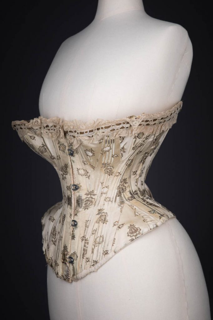 Metal & Silk Brocade Corset With Ribbonslot Lace Trim, c. 1900s. From The Underpinnings Museum collection, photography by Tigz Rice.