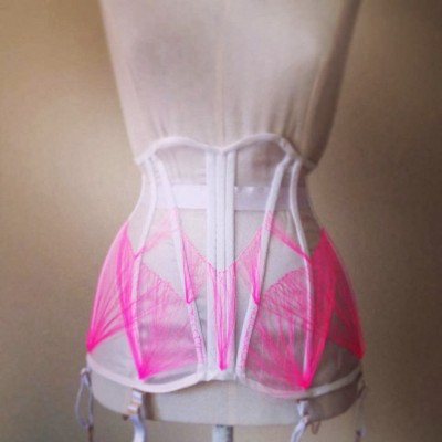 Floating flossing on a sheer corset by Alicia Rose.