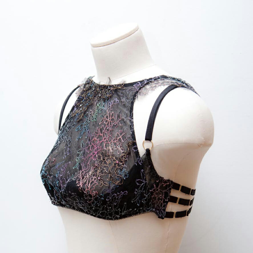 The lace for this bra was painted by hand and then re-embroidered with further lace appliqué and Swarovski crystal beading. It's a one-of-a-kind piece with many hours of hand work. This sort of textile customisation is only really available at the made-to-order, luxury end of the lingerie market. It would be unfeasibly expensive to recreate for a production run. Design by Karolina Laskowska